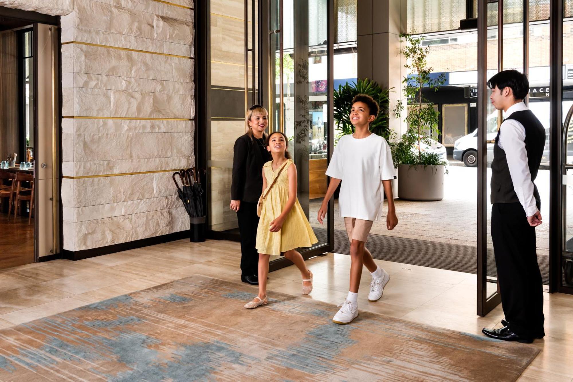 Intercontinental Perth City Centre By Ihg Εξωτερικό φωτογραφία A doorman holding the door open for a guest
